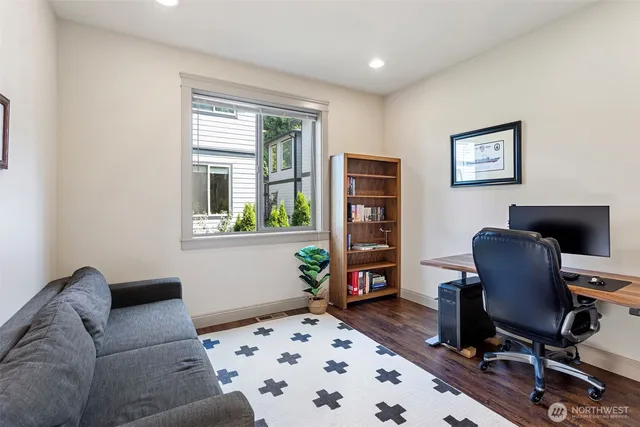 a workspace with furniture and a window