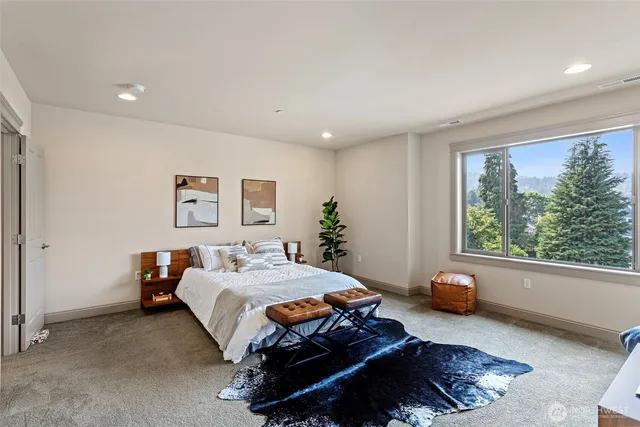 a bedroom with a bed and a couch