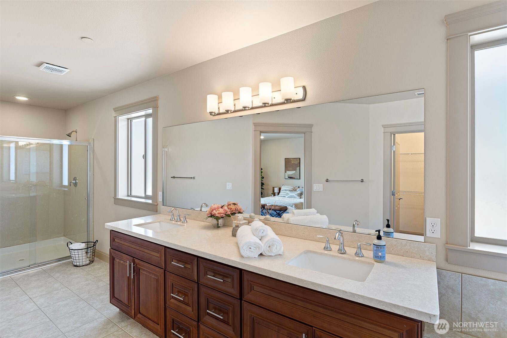 553 Southeast Andrews Street, Unit B Issaquah, WA 98027 - Photo 21 of 28 a bathroom with a double vanity sink and a mirror