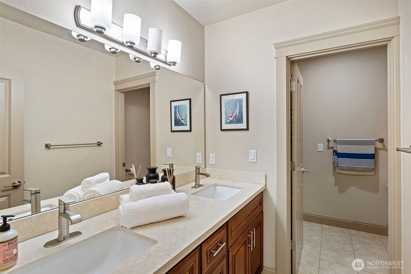 553 Southeast Andrews Street, Unit B Issaquah, WA 98027 - Photo 27 of 28 a en suite bathroom with a granite countertop sink a mirror and shower