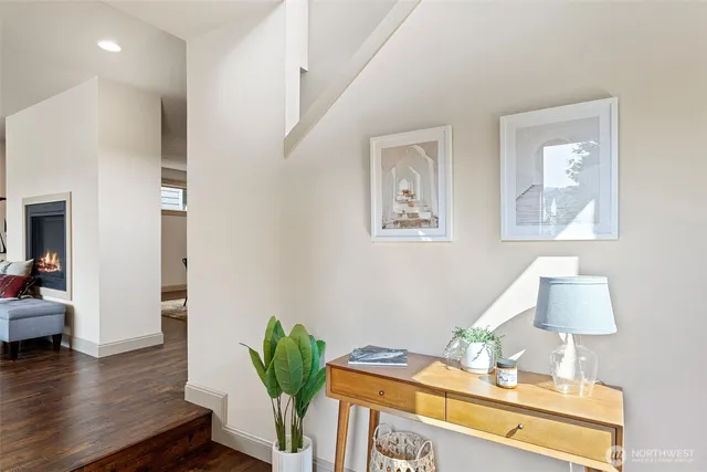a bedroom with furniture and a wooden floor