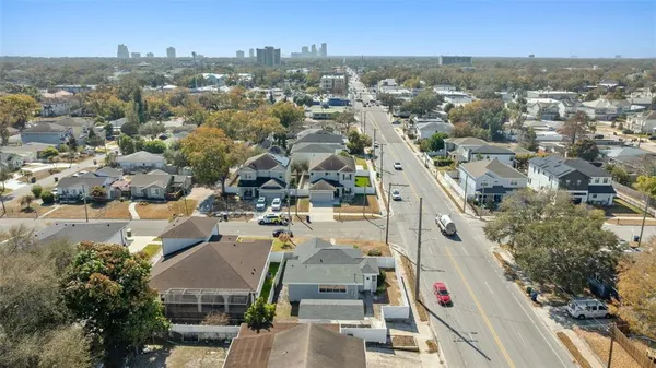 an aerial view of residential houses with outdoor space