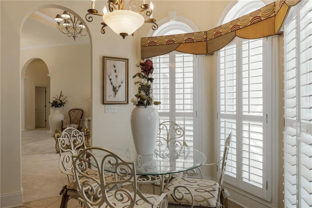 7249 Confederate Lane Villa Rica, GA 30180 - Photo 11 of 49 a view of a dining room with furniture and chandelier