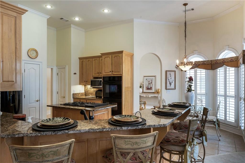 7249 Confederate Lane Villa Rica, GA 30180 - Photo 13 of 49 a kitchen with stainless steel appliances granite countertop a stove and a refrigerator
