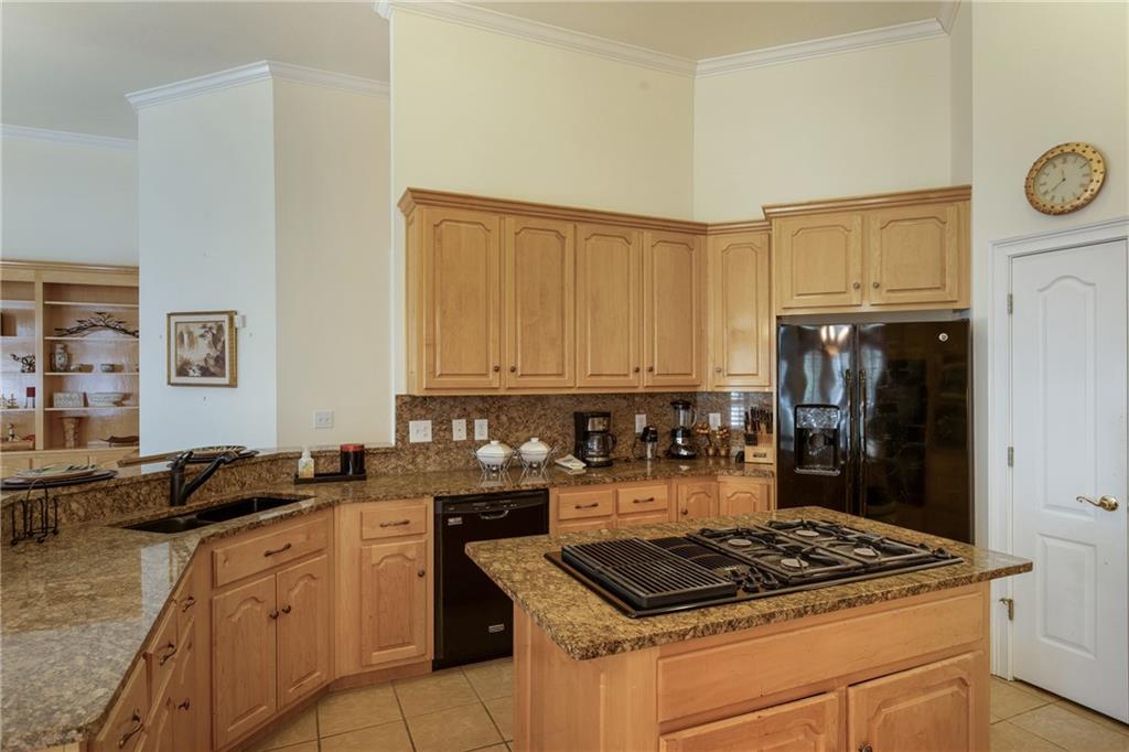 7249 Confederate Lane Villa Rica, GA 30180 - Photo 14 of 49 a kitchen with a stove a sink and a refrigerator