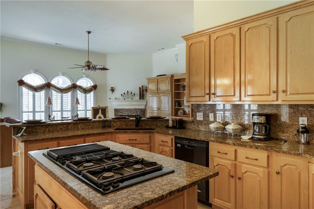 7249 Confederate Lane Villa Rica, GA 30180 - Photo 15 of 49 a kitchen with a stove and a refrigerator