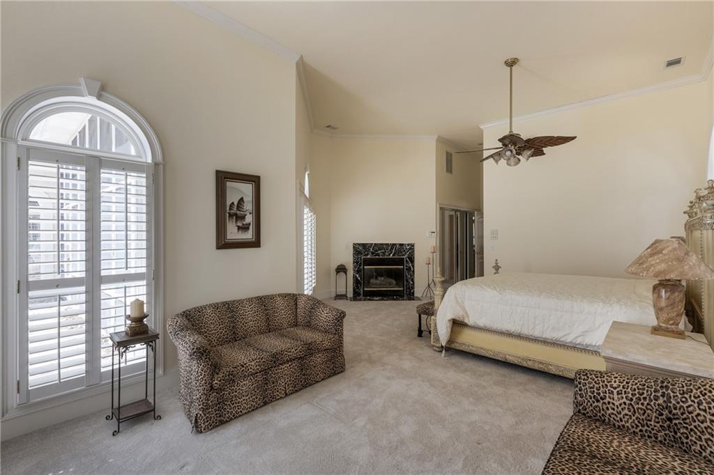 7249 Confederate Lane Villa Rica, GA 30180 - Photo 24 of 49 a spacious bedroom with a bed a couch and a window