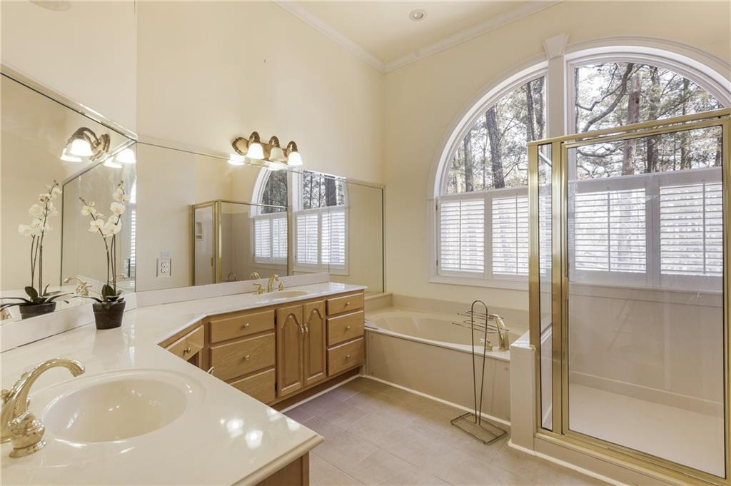 7249 Confederate Lane Villa Rica, GA 30180 - Photo 26 of 49 a spacious bathroom with a bathtub and a sink