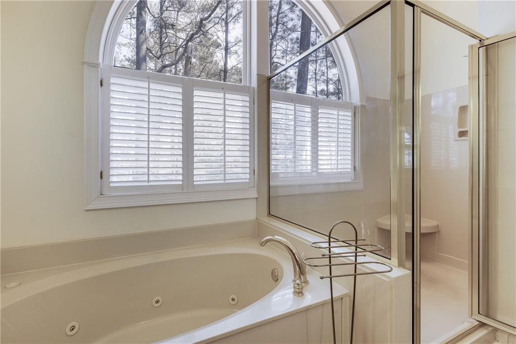 7249 Confederate Lane Villa Rica, GA 30180 - Photo 29 of 49 a bathroom with a bathtub and a shower