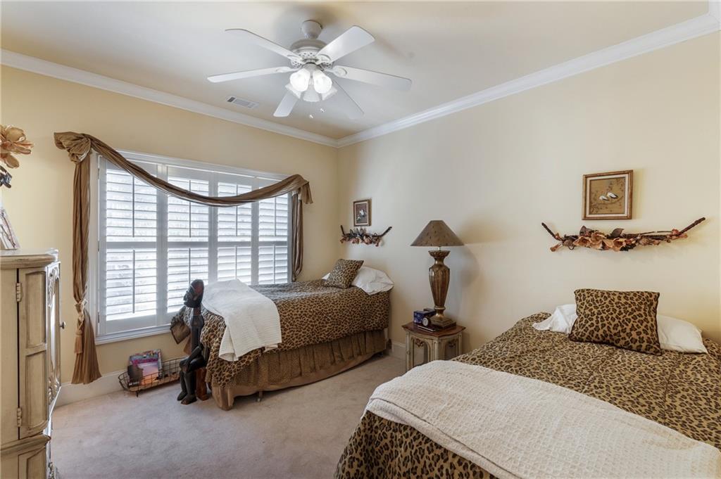 7249 Confederate Lane Villa Rica, GA 30180 - Photo 33 of 49 a bedroom with two beds and a large window