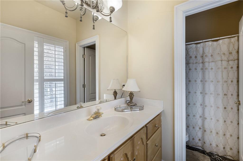 7249 Confederate Lane Villa Rica, GA 30180 - Photo 34 of 49 a bathroom with a sink and a mirror