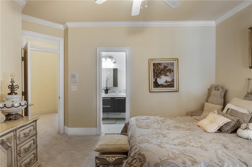 7249 Confederate Lane Villa Rica, GA 30180 - Photo 36 of 49 a bedroom with a bed and a cabinets