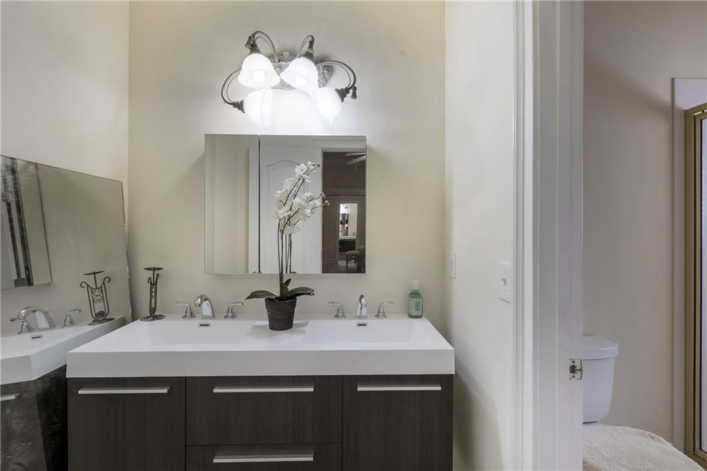 7249 Confederate Lane Villa Rica, GA 30180 - Photo 38 of 49 a bathroom with a sink and a mirror