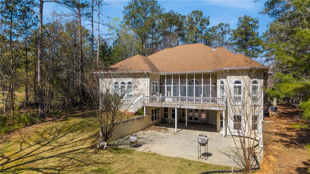 7249 Confederate Lane Villa Rica, GA 30180 - Photo 45 of 49 a view of a balcony with a barbeque grill and a small yard