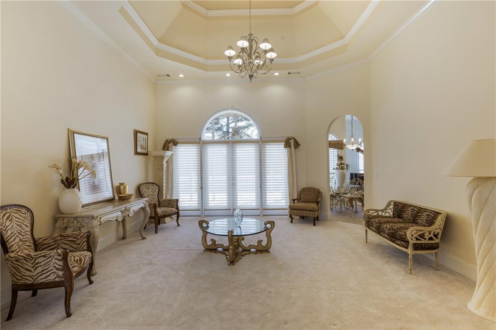 7249 Confederate Lane Villa Rica, GA 30180 - Photo 5 of 49 a living room with furniture and a chandelier