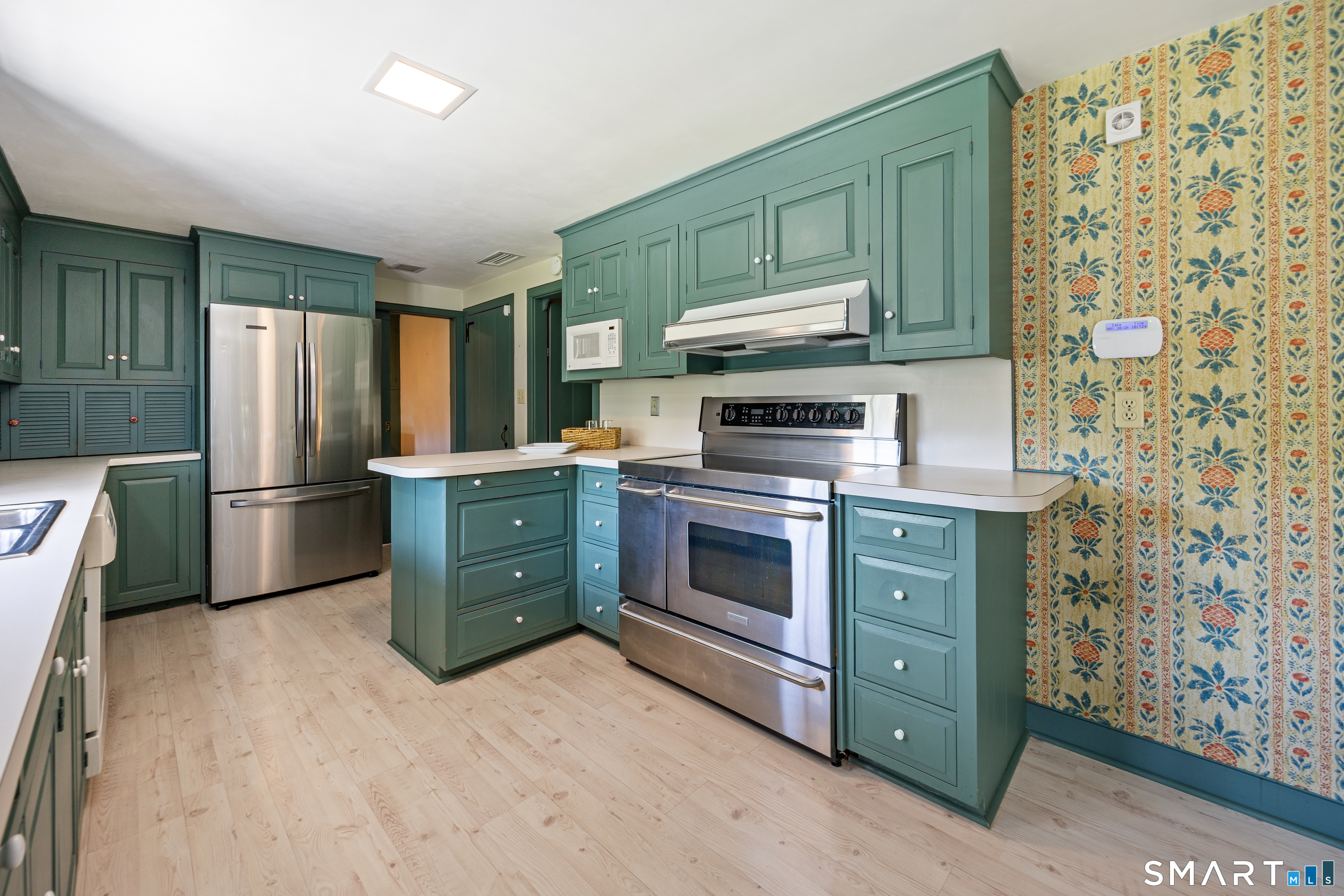 52 Susan Lane Meriden, CT 06450 - Photo 12 of 28 a kitchen with stainless steel appliances a stove a refrigerator and a cabinets