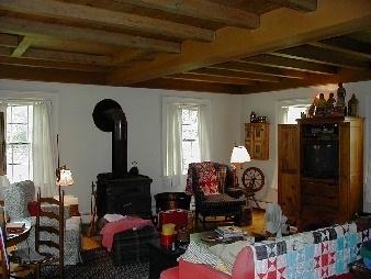 810 Swamp Road Richmond, MA 01254 - Photo 2 of 2 a living room with furniture and a fireplace