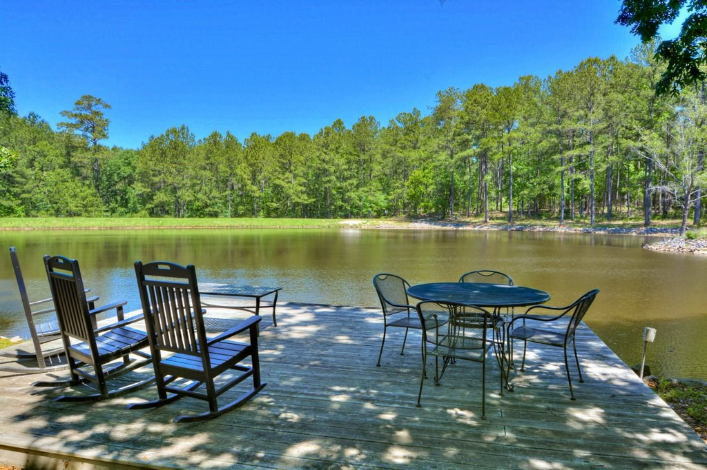 191 North Martintown Road Edgefield, SC 29824 - Photo 52 of 75 a view of a lake with table and chairs