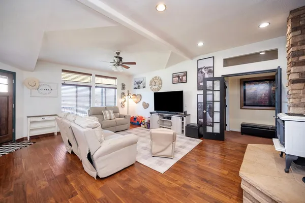 a dining room with furniture and wooden floor