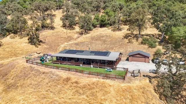 view of house with yard and seating area