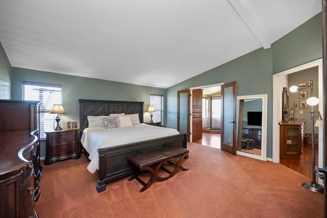 a bedroom with a bed and furniture