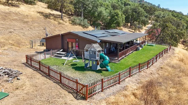 a small pool with a yard in front of it