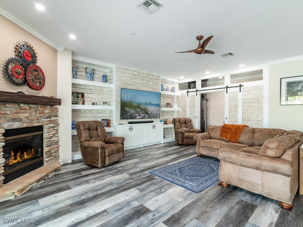 16410 Oakview Circle Alva, FL 33920 - Photo 13 of 39 a living room with furniture and a fireplace