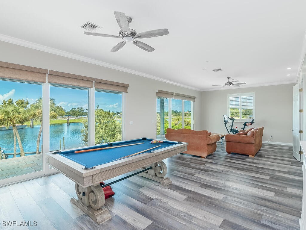16410 Oakview Circle Alva, FL 33920 - Photo 17 of 39 a living room with furniture pool table and a ceiling fan
