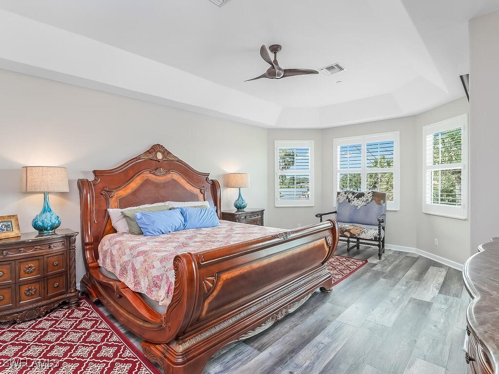 16410 Oakview Circle Alva, FL 33920 - Photo 20 of 39 a bedroom with a bed and windows