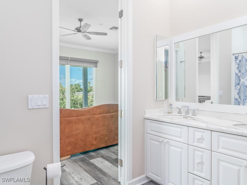 16410 Oakview Circle Alva, FL 33920 - Photo 26 of 39 a en suite bathroom with a granite countertop sink and a mirror