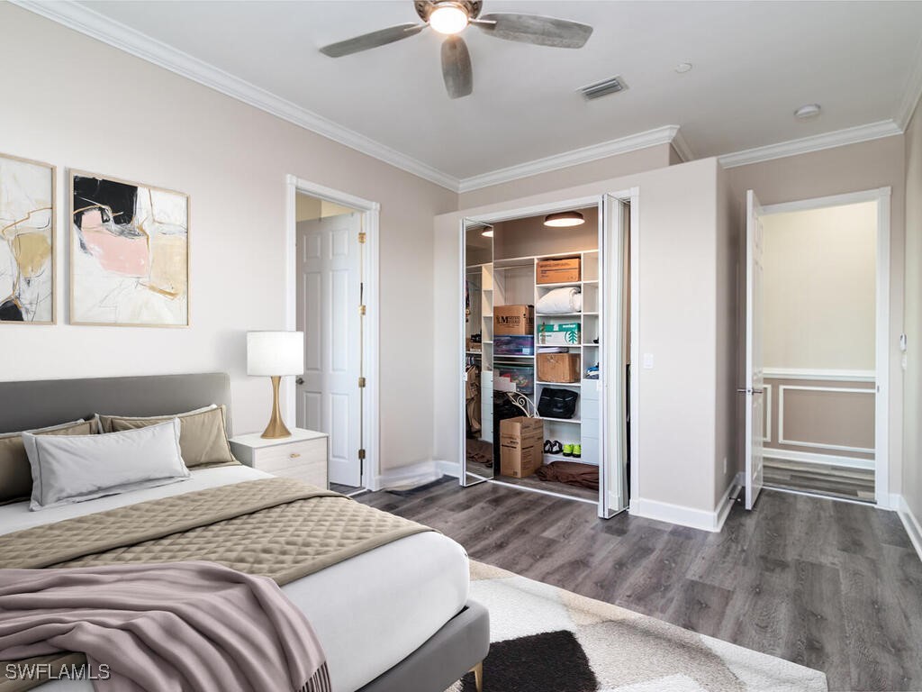 16410 Oakview Circle Alva, FL 33920 - Photo 27 of 39 a bedroom with a bed and a chandelier