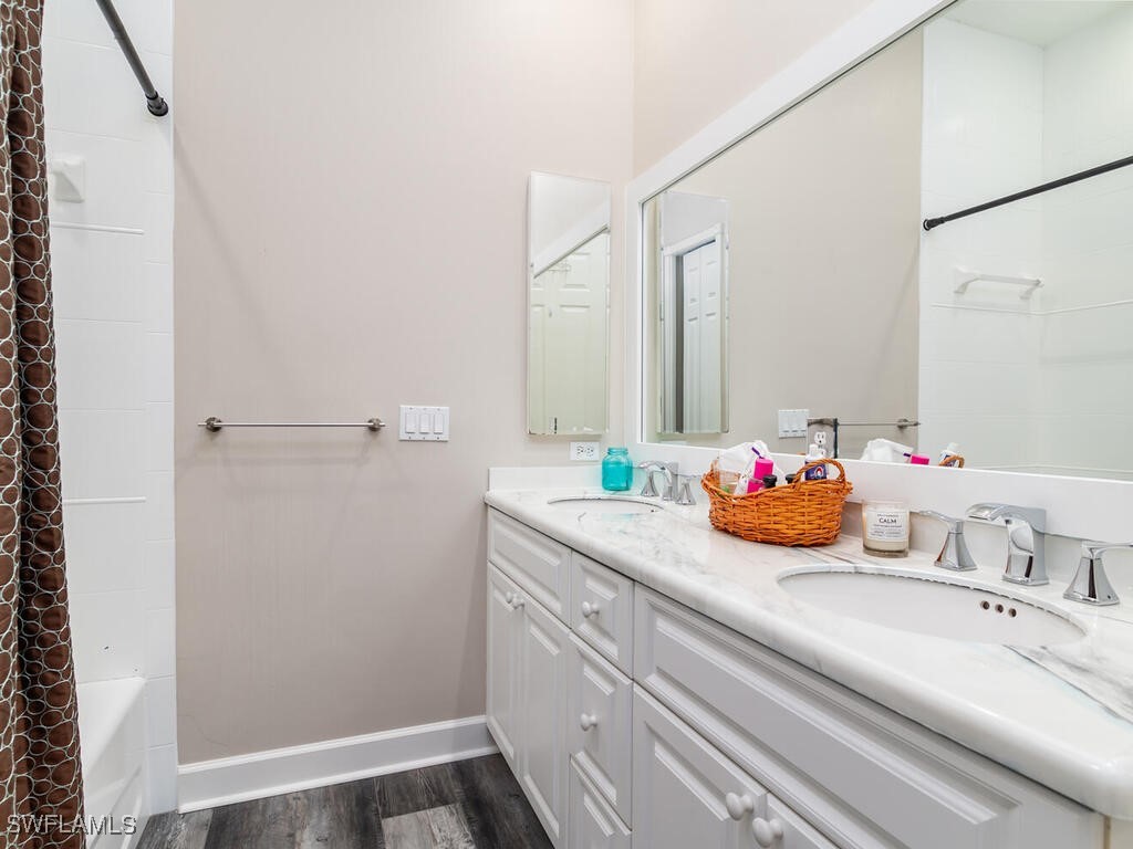 16410 Oakview Circle Alva, FL 33920 - Photo 28 of 39 a bathroom with a granite countertop sink and a mirror