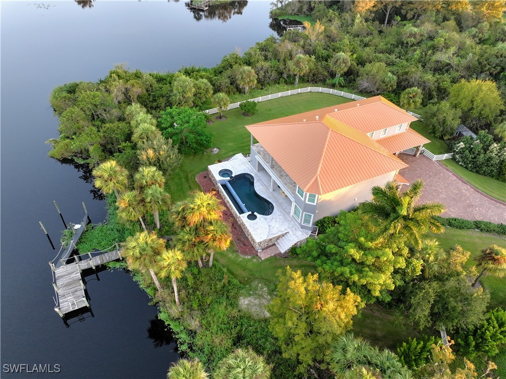 16410 Oakview Circle Alva, FL 33920 - Photo 3 of 39 an aerial view of a house with garden space and street view