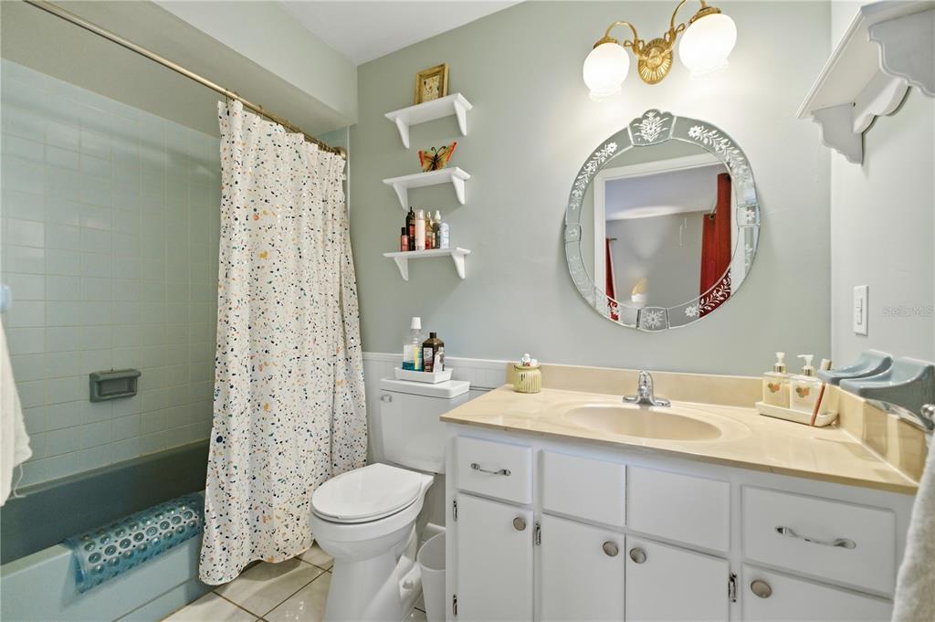 8951 Southwest 202nd Avenue Road Dunnellon, FL 34431 - Photo 17 of 38 a bathroom with a sink a toilet and a mirror