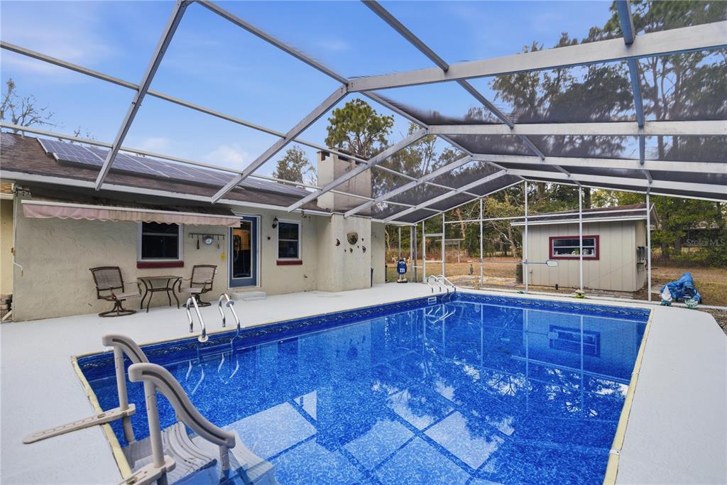 8951 Southwest 202nd Avenue Road Dunnellon, FL 34431 - Photo 25 of 38 a view of a room with wooden furniture and a table