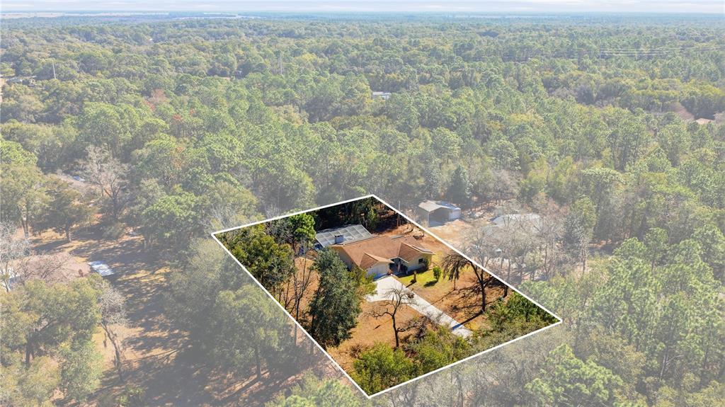 8951 Southwest 202nd Avenue Road Dunnellon, FL 34431 - Photo 32 of 38 an aerial view of houses with yard