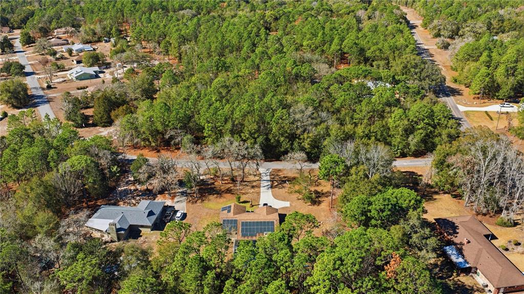 8951 Southwest 202nd Avenue Road Dunnellon, FL 34431 - Photo 35 of 38 an aerial view of residential house with outdoor space and trees all around