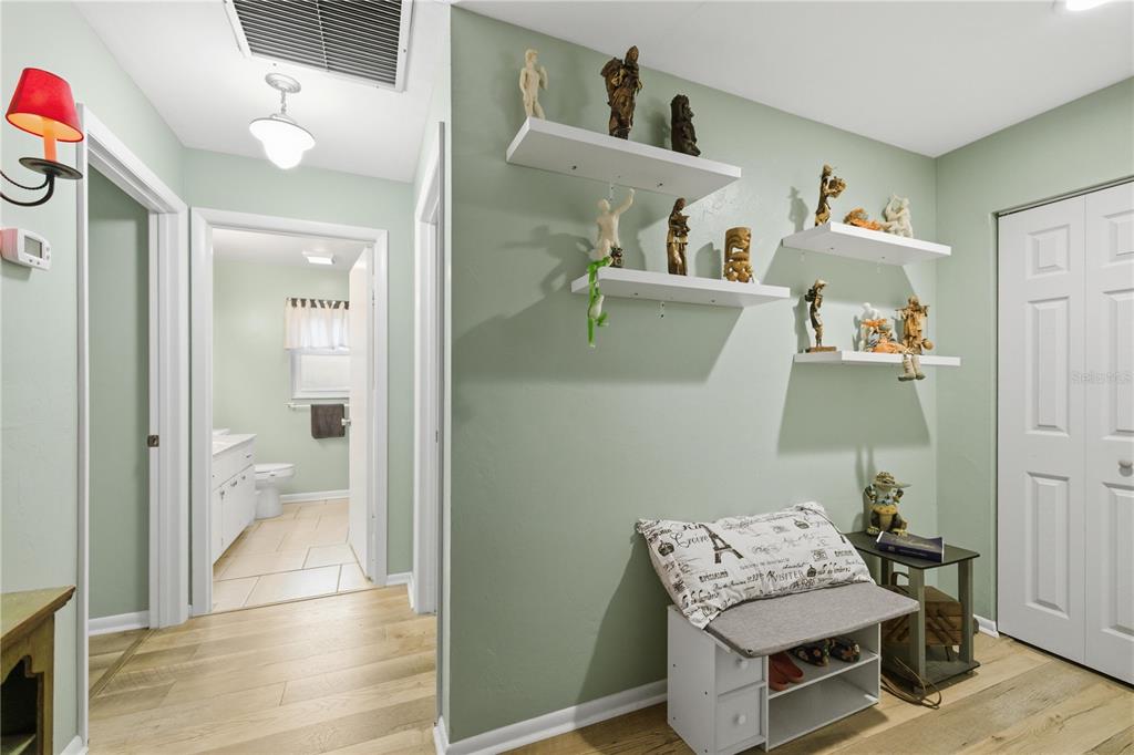 8951 Southwest 202nd Avenue Road Dunnellon, FL 34431 - Photo 5 of 38 a living room with furniture and a wooden floor