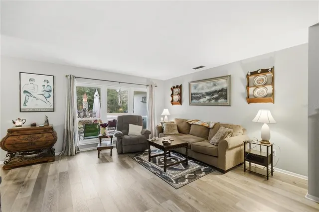 a living room with furniture and a window
