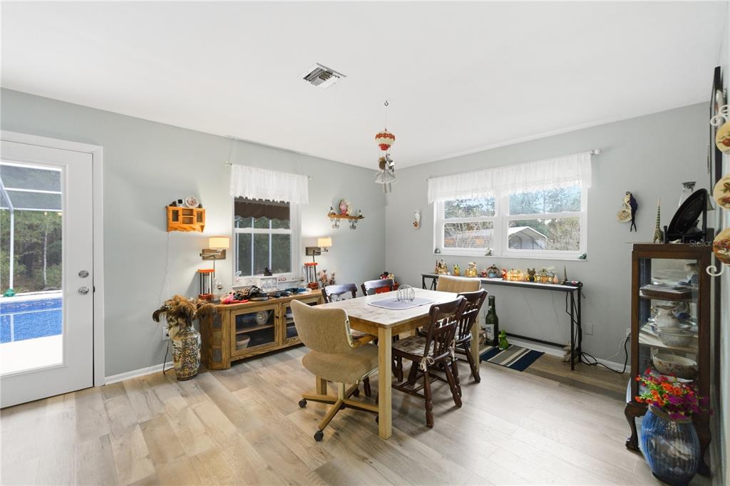 8951 Southwest 202nd Avenue Road Dunnellon, FL 34431 - Photo 8 of 38 a view of a workspace with furniture and a window
