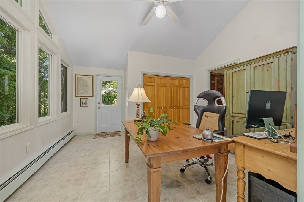 445 Cushing Street Hingham, MA 02043 - Photo 12 of 29 a view of a workspace with furniture and a window