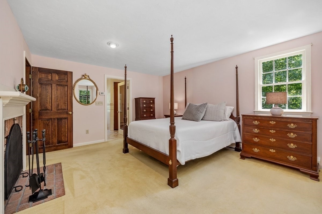 445 Cushing Street Hingham, MA 02043 - Photo 14 of 29 a bedroom with a bed closet and a window