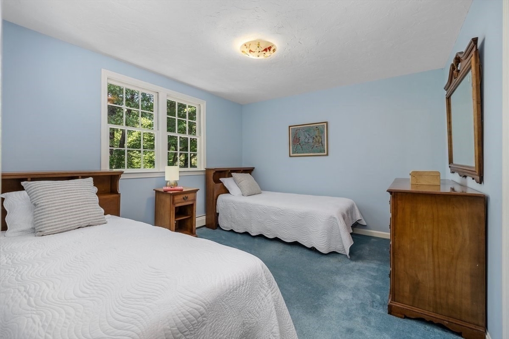 445 Cushing Street Hingham, MA 02043 - Photo 19 of 29 a bedroom with two beds and a window