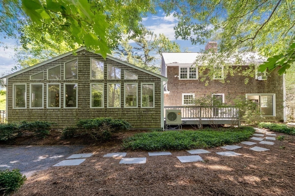 445 Cushing Street Hingham, MA 02043 - Photo 24 of 29 a view of a house with a yard