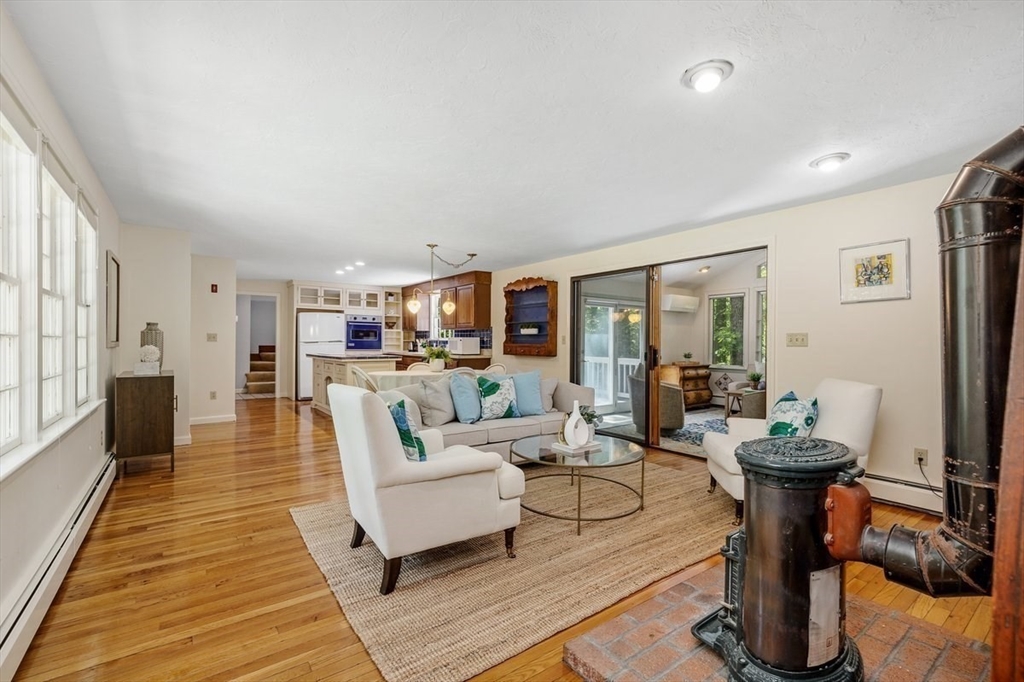 445 Cushing Street Hingham, MA 02043 - Photo 3 of 29 a living room with furniture a couch and a table