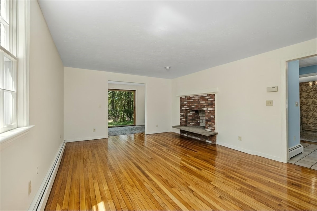 445 Cushing Street Hingham, MA 02043 - Photo 10 of 29 an empty room with wooden floor and windows