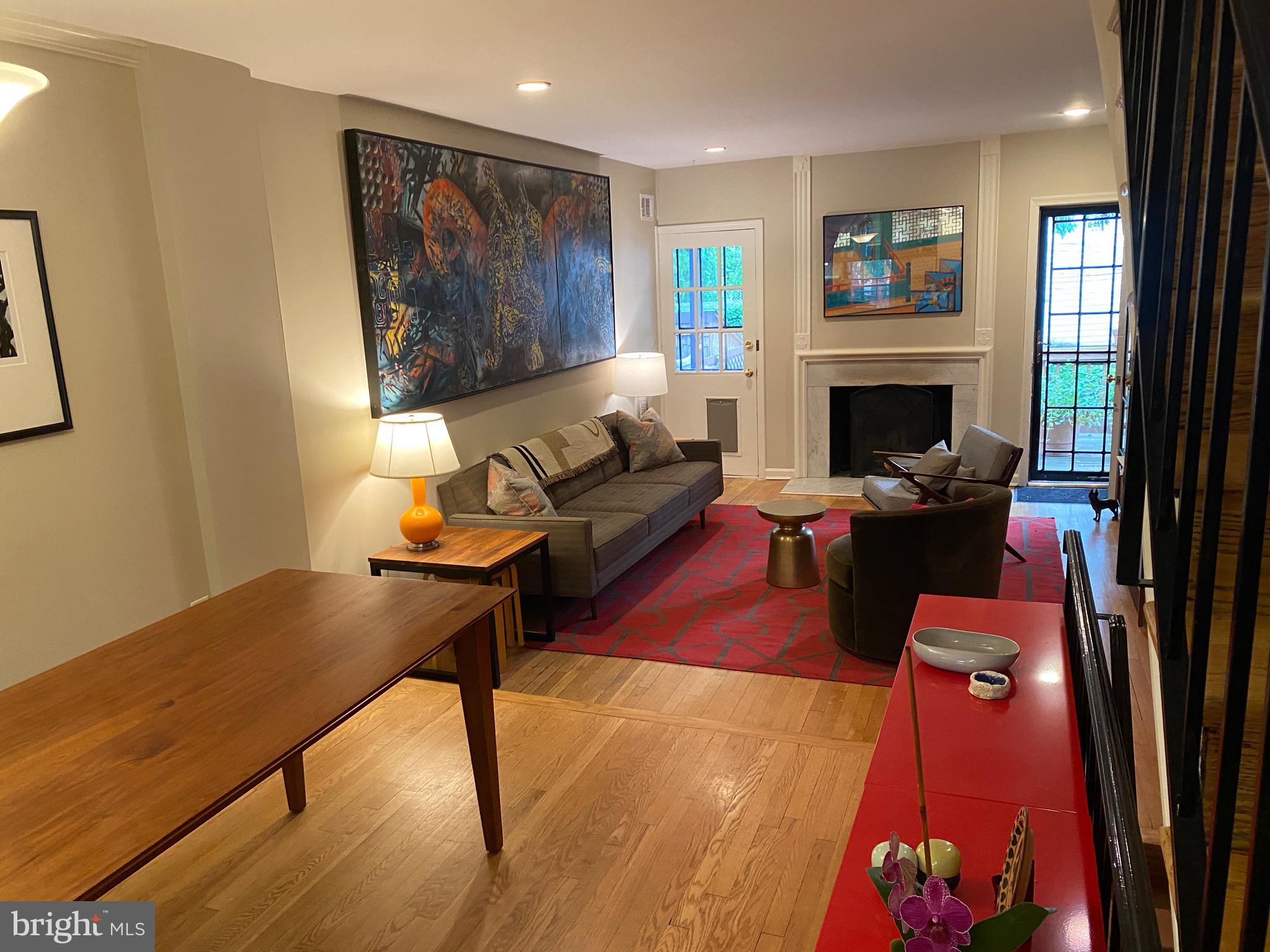 339 11th Street Southeast Washington, DC 20003 - Photo 26 of 39 a living room with furniture a fireplace and a window