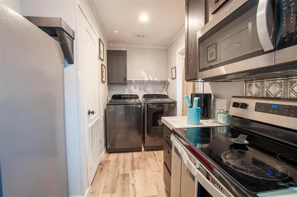 a kitchen with a sink stove and refrigerator