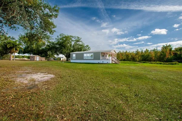 a view of a house with a big yard