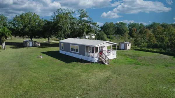 a view of a house with a big yard